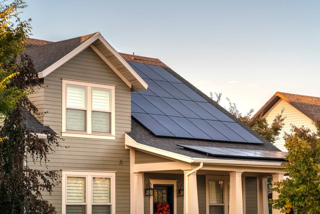 Solar panels installed on the roof of a two storey house