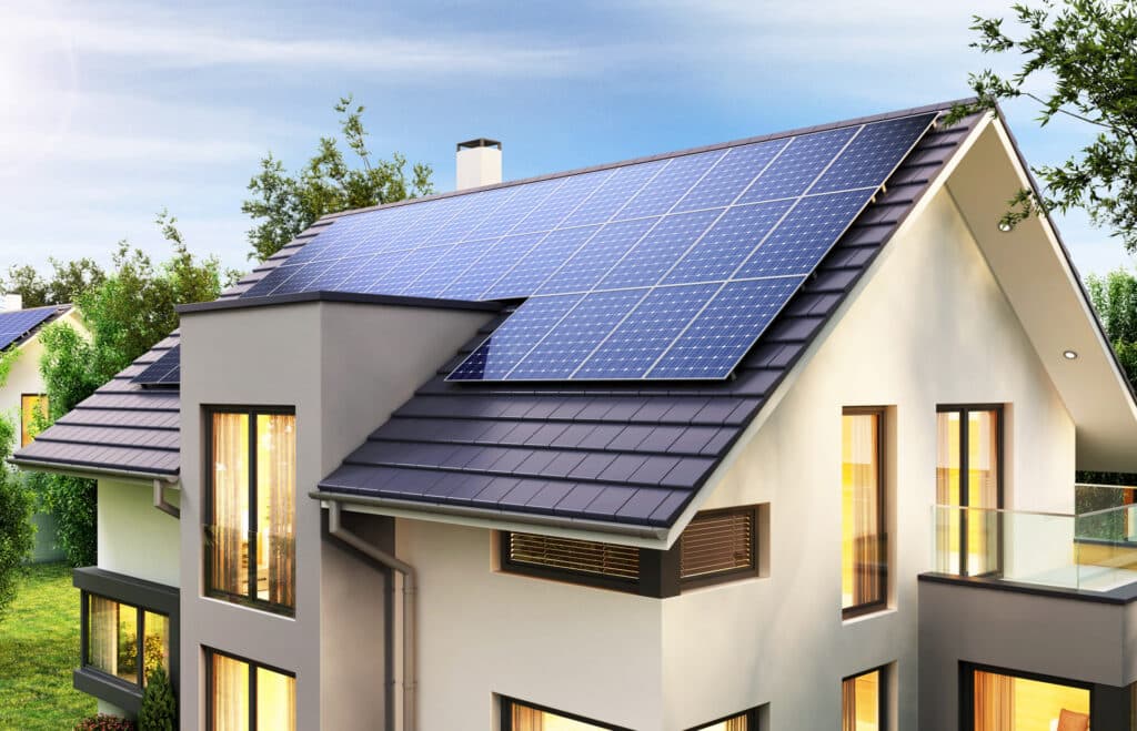 Solar panels installed on the roof of a three floor house